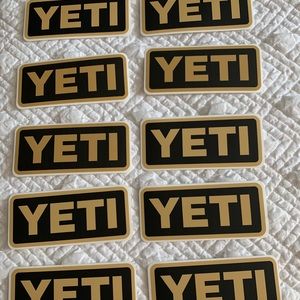 9 Yeti Stickers- Black and Tan. Note: 10 pictured but listing is for 9.